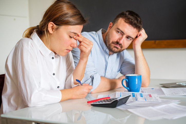 Stressed couple at table