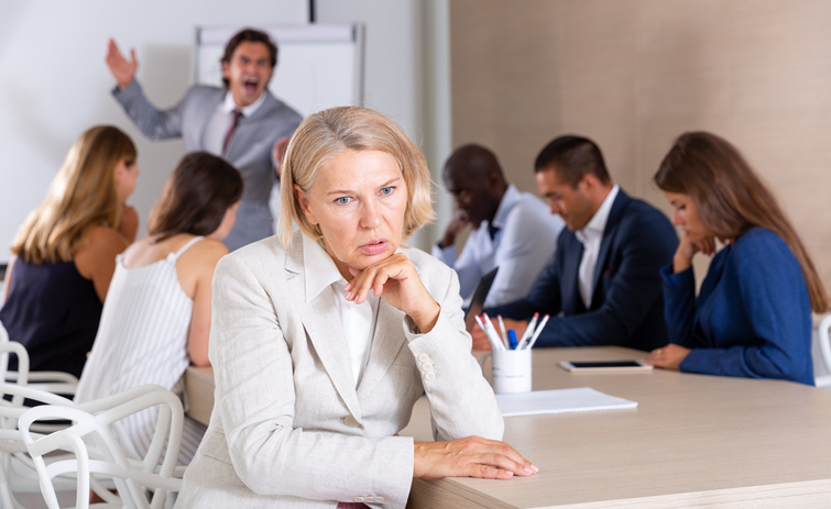 Disinterested woman at business meeting