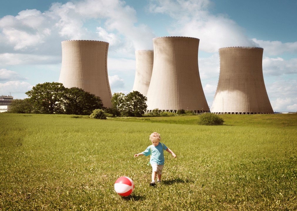 Child playing near nuclear plant
