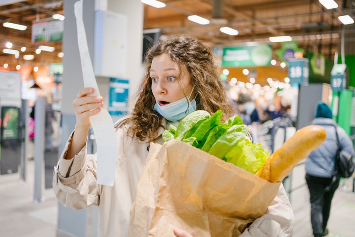 Woman Surprised at Receipt