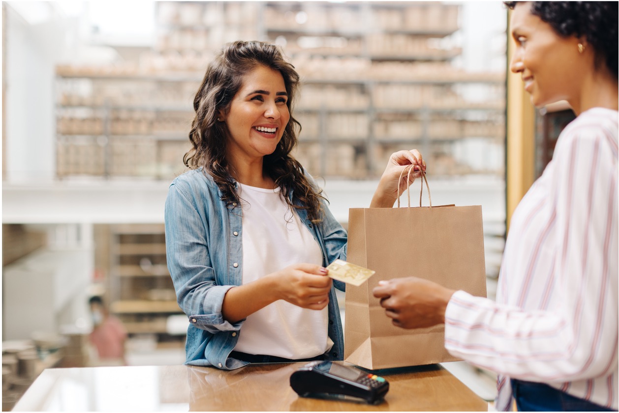 Woman pays for purchase with credit card
