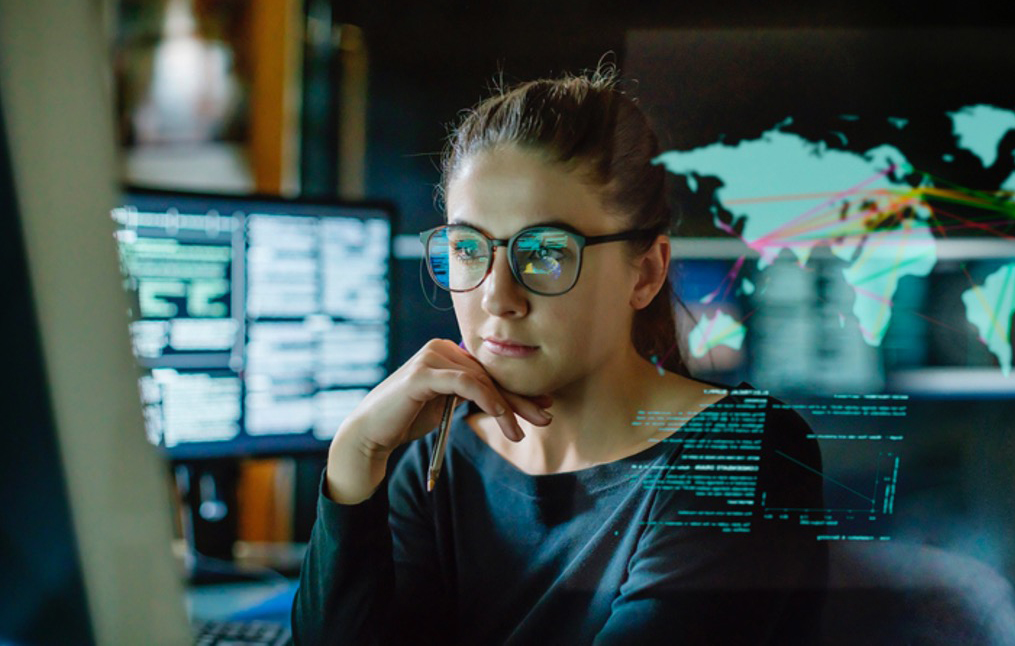 Office woman staring at a computer.