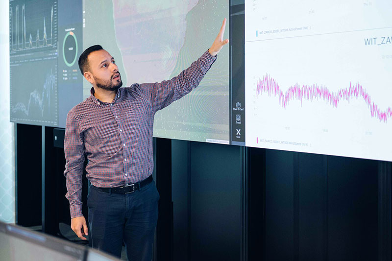 Man presenting graphs