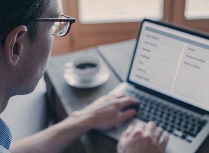 Man typing on laptop