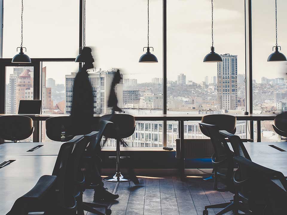 Image of empty office chairs and desk
