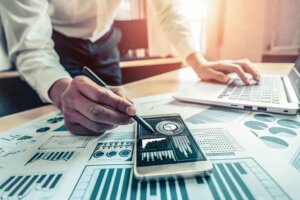 person-pointing-to-charts